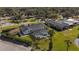 An aerial view showcasing a house with a private pool and a large backyard at 1401 Lake Shore Blvd, Tavares, FL 32778