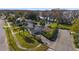 Aerial view of a house near the lake with a large backyard and a spacious driveway at 1401 Lake Shore Blvd, Tavares, FL 32778