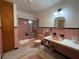 Pink tile bathroom with shower and bathtub at 1401 Lake Shore Blvd, Tavares, FL 32778