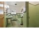 Retro bathroom with light green tile, bathtub and pedestal sink at 1401 Lake Shore Blvd, Tavares, FL 32778