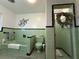 Retro bathroom with mint green tile and shower at 1401 Lake Shore Blvd, Tavares, FL 32778