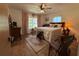 Cozy bedroom with a queen-size bed and window seat at 1401 Lake Shore Blvd, Tavares, FL 32778