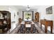 Mid century modern dining room with an oval glass-top table at 1401 Lake Shore Blvd, Tavares, FL 32778