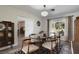 Mid century modern dining room with an oval glass-top table at 1401 Lake Shore Blvd, Tavares, FL 32778