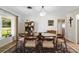 Mid century modern dining room with an oval glass-top table at 1401 Lake Shore Blvd, Tavares, FL 32778