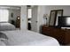 Large bedroom with mirrored closet doors and ensuite bathroom at 1401 W Highway 50 # 89, Clermont, FL 34711