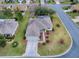 Aerial view of a single-Gathering home with a landscaped yard and two-car garage at 14267 Se 85Th Ter, Summerfield, FL 34491