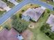 Aerial view showcasing a home's back screened patio and surrounding landscape at 14267 Se 85Th Ter, Summerfield, FL 34491