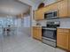 Open concept kitchen with stainless steel appliances and view of dining area at 14267 Se 85Th Ter, Summerfield, FL 34491