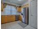 Stainless steel appliances and light wood cabinets in this kitchen at 14267 Se 85Th Ter, Summerfield, FL 34491