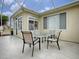 Screened patio with table and chairs for outdoor dining at 14267 Se 85Th Ter, Summerfield, FL 34491