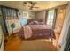 Primary bedroom with a queen-size bed and dresser at 1503 Woodlyn Dr, Leesburg, FL 34748