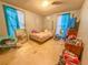 Bright bedroom with ample space for a bed and additional furniture at 1503 Woodlyn Dr, Leesburg, FL 34748