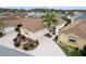 Aerial view of a home in a neighborhood with palm trees at 1521 Trenton Ln, The Villages, FL 32162