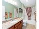 Clean bathroom with granite countertop and tub shower combo at 1521 Trenton Ln, The Villages, FL 32162