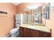 Bathroom with granite countertop, updated vanity and shower at 1521 Trenton Ln, The Villages, FL 32162