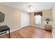 Simple bedroom with wood floors and ceiling fan at 1521 Trenton Ln, The Villages, FL 32162