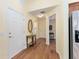 Bright hallway with wood floors and access to other rooms at 1521 Trenton Ln, The Villages, FL 32162