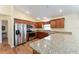 Kitchen with stainless steel appliances and granite countertops at 1521 Trenton Ln, The Villages, FL 32162