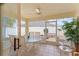 Bright, screened porch with tiled floor and outdoor furniture at 1521 Trenton Ln, The Villages, FL 32162