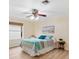 Spacious bedroom with a ceiling fan and wood-look flooring at 1526 Lozano Ave, Lady Lake, FL 32159