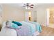 Bright bedroom with ceiling fan and en-suite bathroom access at 1526 Lozano Ave, Lady Lake, FL 32159