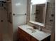 Second bathroom with vanity and walk-in shower at 164 Jacaranda Dr, Leesburg, FL 34748