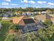 Aerial view showcasing home with solar panels and pool at 1712 Palo Alto Ave, The Villages, FL 32159