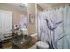 Bathroom with a shower/tub combo and a pedestal sink at 1712 Palo Alto Ave, Lady Lake, FL 32159