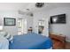 Main bedroom with ensuite bathroom and hardwood floors at 1712 Palo Alto Ave, The Villages, FL 32159