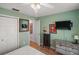 Guest bedroom with a TV and ample closet space at 1712 Palo Alto Ave, Lady Lake, FL 32159