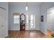 Bright entryway with wood floors and glass door at 1712 Palo Alto Ave, The Villages, FL 32159