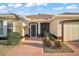 Front view of house showcasing walkway and landscaping at 1712 Palo Alto Ave, The Villages, FL 32159