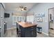 Kitchen island with butcher block countertop and seating at 1712 Palo Alto Ave, Lady Lake, FL 32159