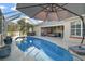 Inviting pool area with covered patio and spa at 1712 Palo Alto Ave, The Villages, FL 32159