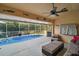 Enclosed pool area with seating and an open view at 1712 Palo Alto Ave, Lady Lake, FL 32159