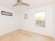 Spacious bedroom with neutral decor and large window at 17120 Cypresswood Way, Clermont, FL 34714