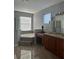 Elegant bathroom with a large soaking tub and granite vanity at 1735 Southern Oak Loop, Minneola, FL 34715