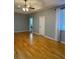 Large main bedroom with hardwood floors and ceiling fan at 1735 Southern Oak Loop, Minneola, FL 34715