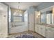 Elegant bathroom with soaking tub, double vanity, and walk-in shower at 17640 Las Brisas Ct, Winter Garden, FL 34787