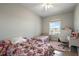 Bedroom with floral bedding, twin bed, and a desk at 17640 Las Brisas Ct, Winter Garden, FL 34787