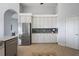 Well-equipped kitchen featuring white cabinetry and granite countertops at 17640 Las Brisas Ct, Winter Garden, FL 34787