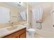 Bathroom with single vanity, bathtub, and shower at 208 Desota Ct, The Villages, FL 32159