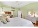 Spacious bedroom with a king-size bed and built-in workspace at 208 Desota Ct, The Villages, FL 32159