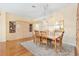 Dining room with hardwood floors, built-in hutch, and wall-mounted mirror at 208 Desota Ct, The Villages, FL 32159