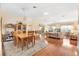 Spacious dining area with hardwood floors and wood dining set at 208 Desota Ct, The Villages, FL 32159