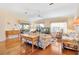 Spacious living room featuring hardwood floors and ample natural light at 208 Desota Ct, The Villages, FL 32159