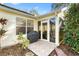 Screened patio with tile flooring and grill at 208 Desota Ct, The Villages, FL 32159