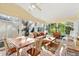 Relaxing sunroom with plenty of seating and natural light at 208 Desota Ct, The Villages, FL 32159