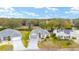 Aerial view of a house with solar panels on a neighboring house at 2123 Barbosa Ct, The Villages, FL 32159